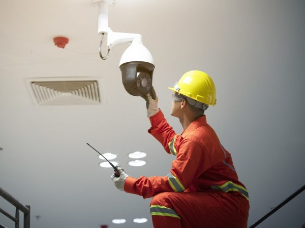 worker doing surveillance repair